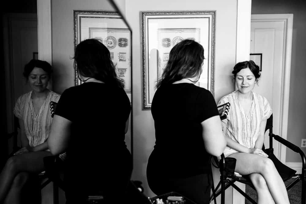 bride getting ready with makeup artist at Naples Hotel