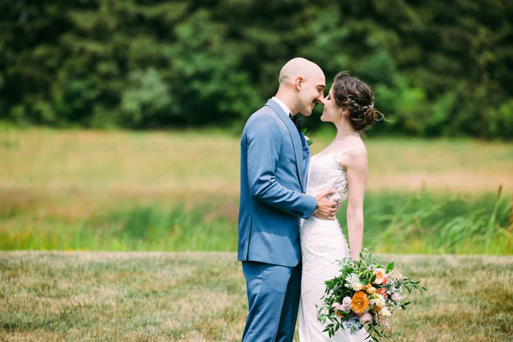 bride and groom almost kissing 